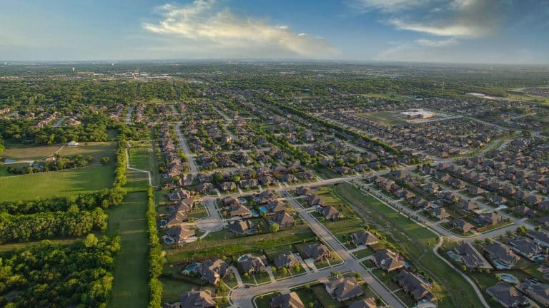 A Texas home glowing warmly at dusk, when free nights electricity plans begin