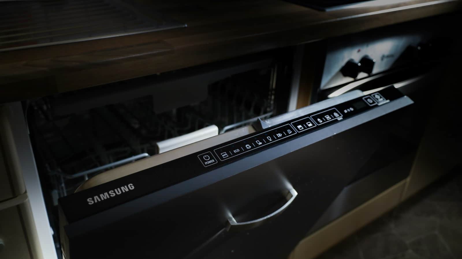 Setting the delay-start timer on a dishwasher to run during free overnight hours