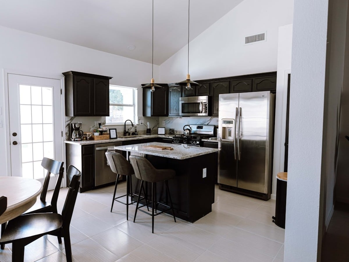 Texas kitchen setting where households compare monthly electricity bills