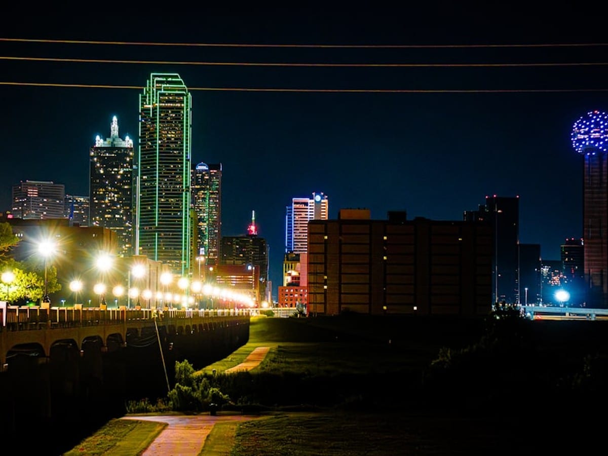 Dallas skyline representing Texas ERCOT electricity market where solar buyback plans operate
