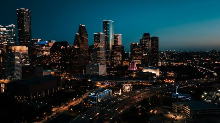Houston Texas skyline at dusk with power transmission lines