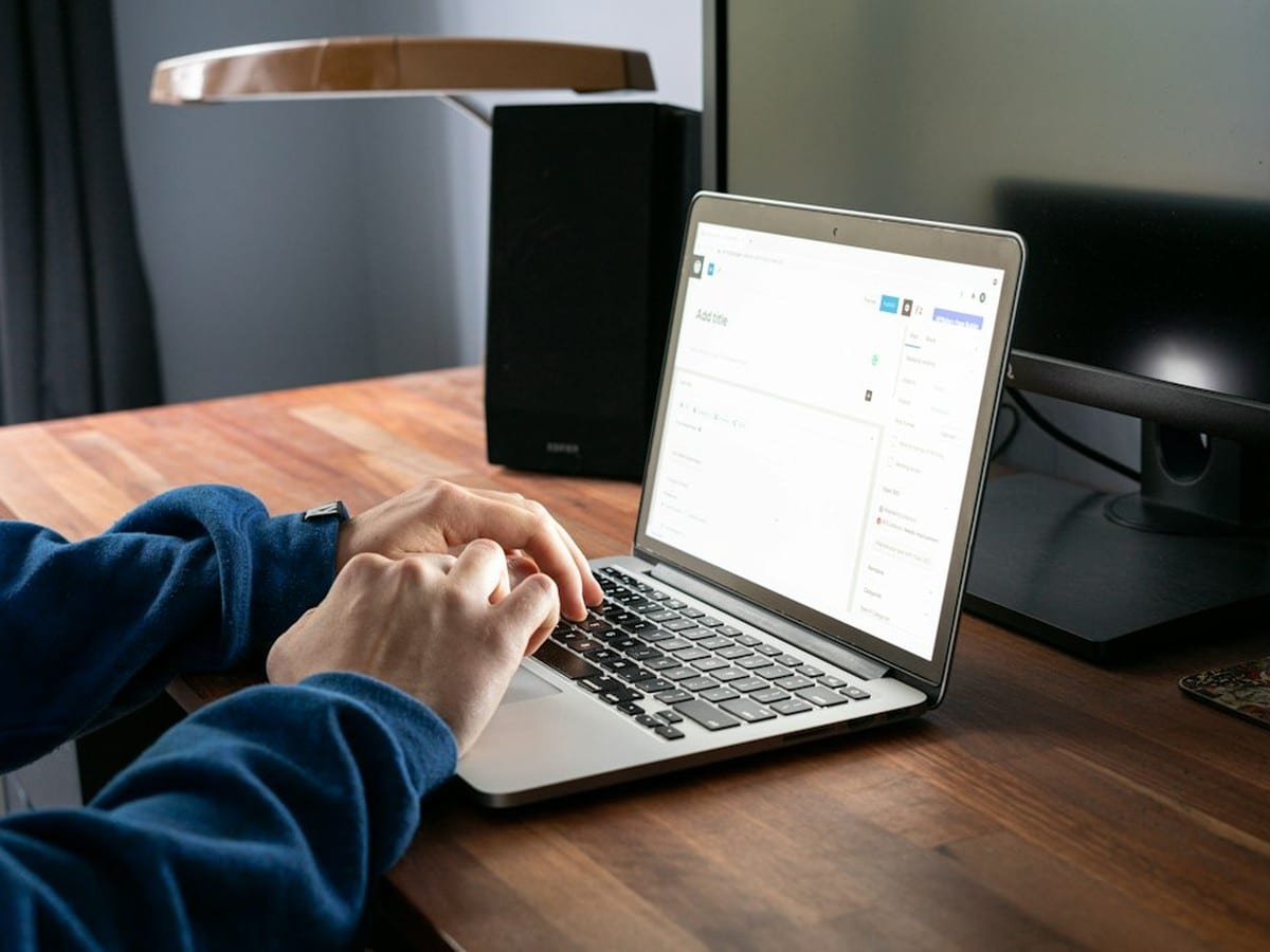 Checking electricity usage data on a laptop to compare against the kWh on a Texas electric bill