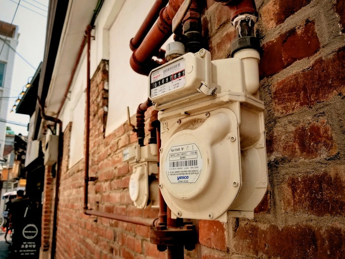 Residential electric meter on a house wall, the ESI ID point that moves to a POLR provider